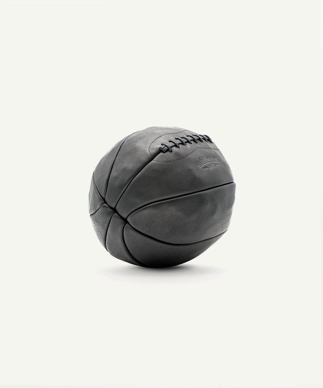 Leather Head Sports 8 lb black medicine ball with durable stitched leather surface for strength training