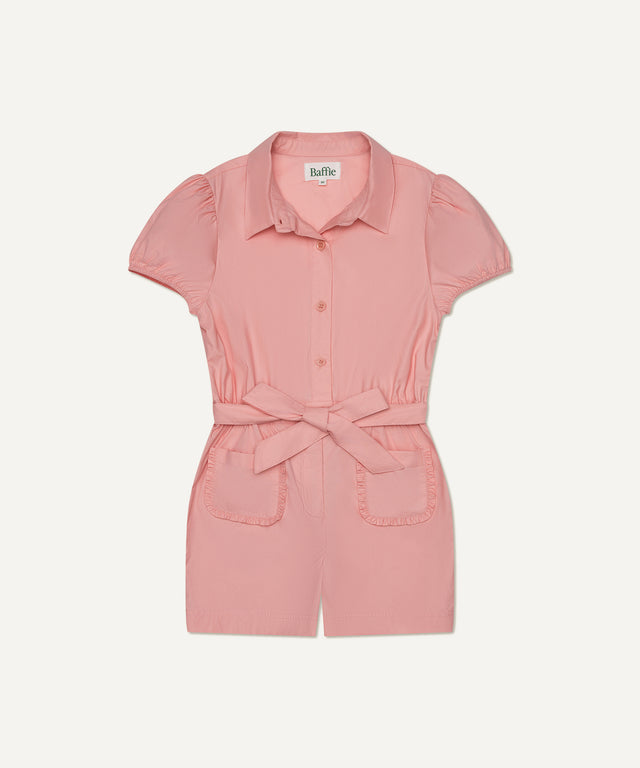 Baffie pink short sleeve romper for kids featuring front pockets and a waist tie ideal for kids golf clothing