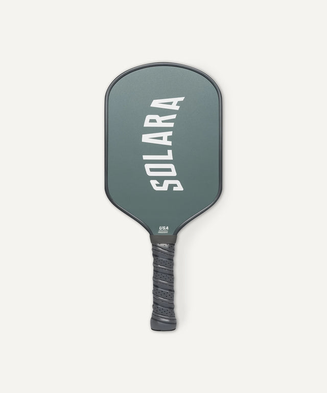 Solara 94 pickleball paddle with dark green face and black grip for improved control