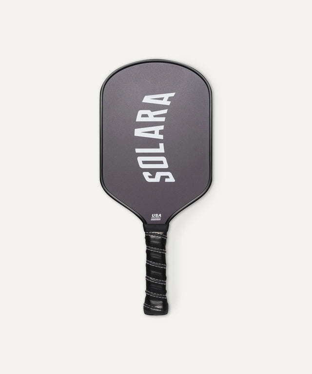 Solara 94 black pickleball paddle with cushioned grip and USA logo on the handle
