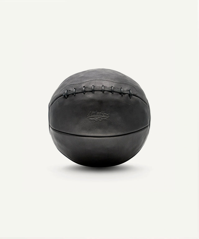 Leather Head Sports 14 lb leather medicine ball in black with stitched design for strength training