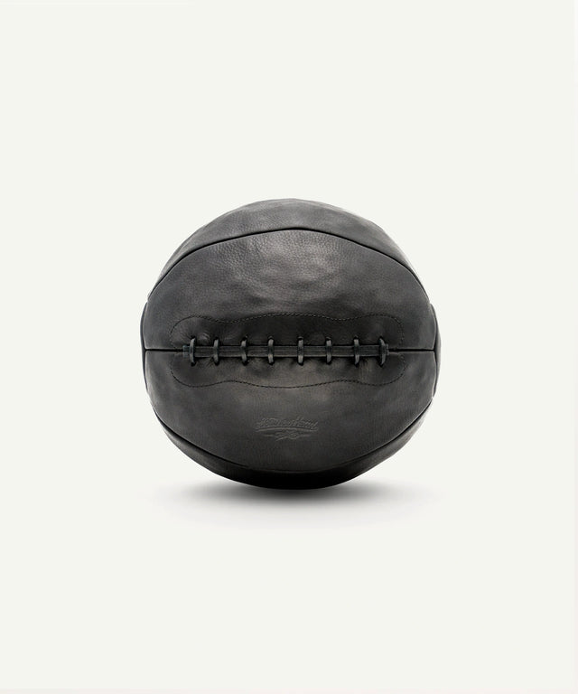 Leather Head Sports 14 lb leather medicine ball in black with stitched detailing for strength training