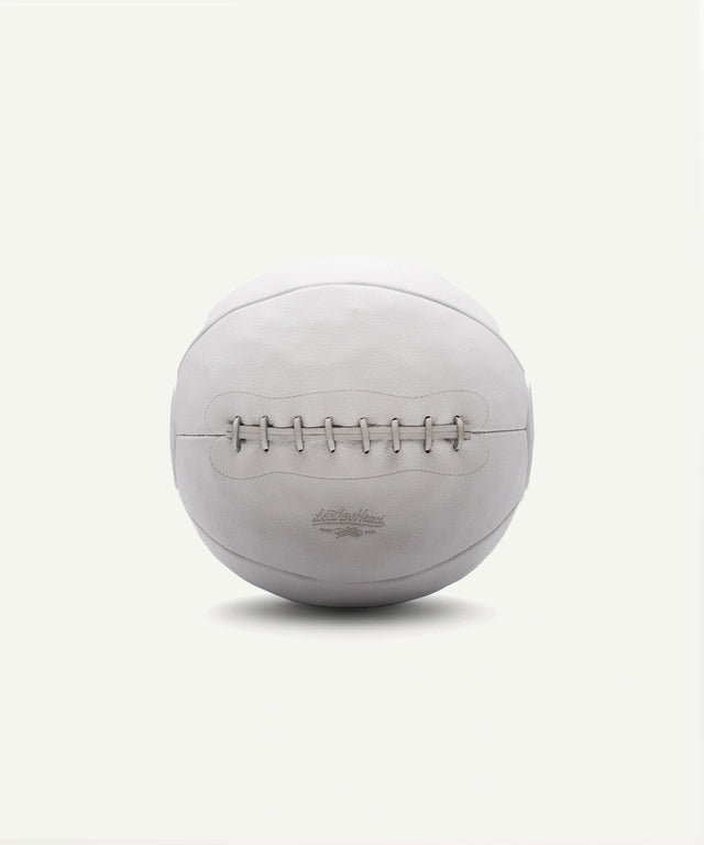 Leather Head Sports 14 lb white medicine ball with stitched leather design for strength training
