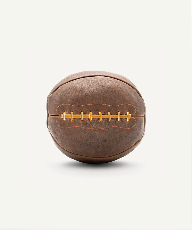14lb leather medicine ball by Leather Head Sports with stitched brown leather design for strength training