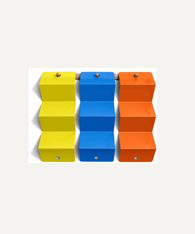 Aesthetic ping pong ball holders in yellow blue and orange by Art of Ping Pong for table tennis organization