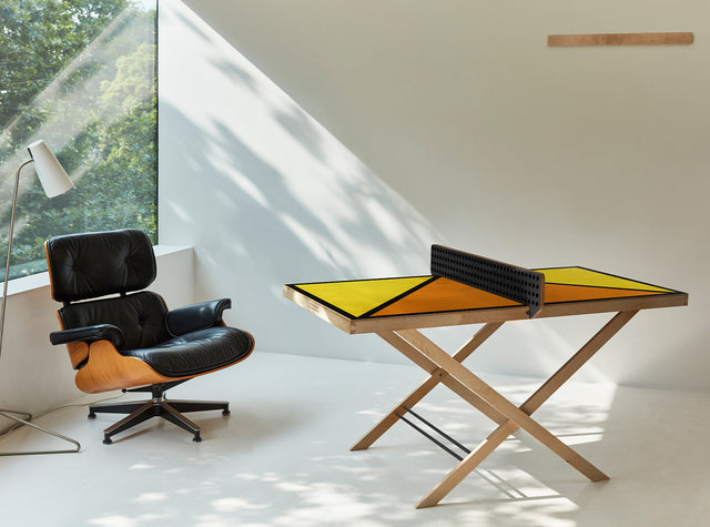 Aesthetic ping pong table tennis art piece with modern geometric design in a bright room