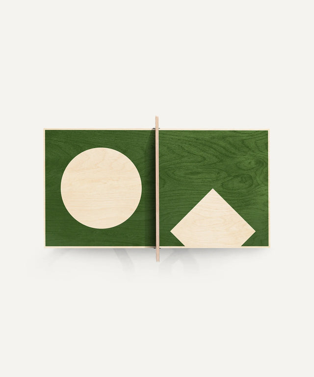 Aesthetic ping pong table tennis art piece with geometric shapes on a green wooden surface
