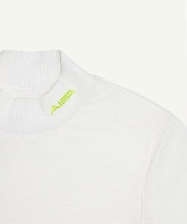 White AIEA Golf turtleneck top with neon logo featuring fashionable womens golf clothing