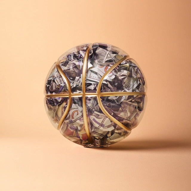 Basketball art by Victor Solomon featuring crumpled money inside clear basketball collectible gifts for basketball fans