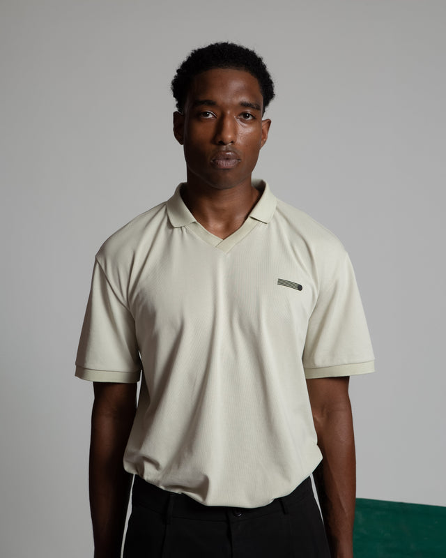 Kadet men's performance polo shirt in beige with short sleeves and a subtle logo on the chest