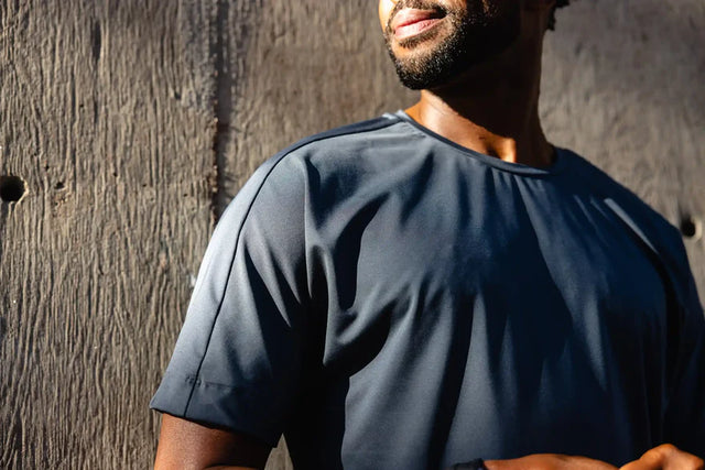 Solstice Athletics men's navy blue short sleeve premium workout clothing shirt close-up