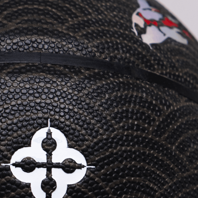 Close-up of Comrade Berlin artistic basketball featuring textured pattern and decorative black and white design