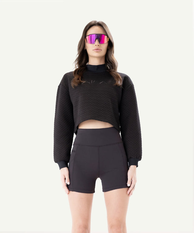 AIEA Golf fashionable womens golf clothing featuring black cropped sweatshirt and high-waisted shorts