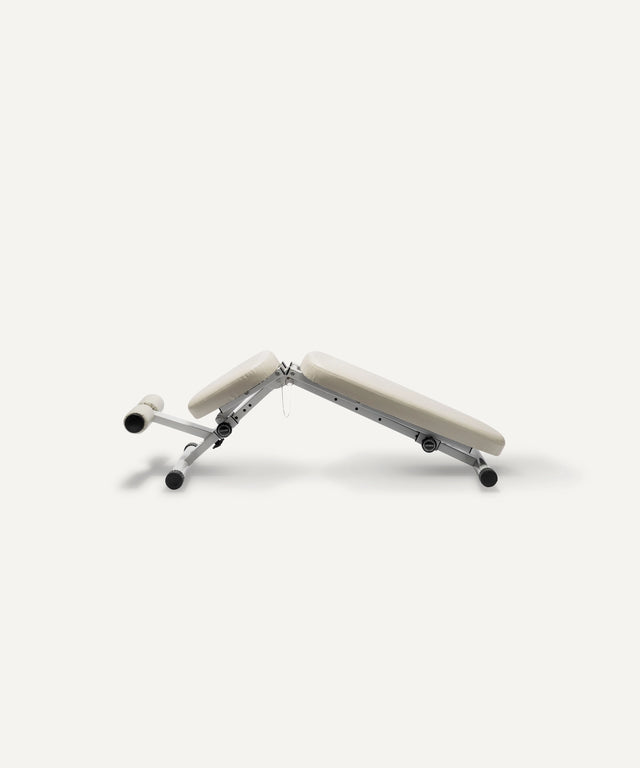 WeGym adjustable fitness bench with padded beige cushions and sturdy metal frame for versatile workouts