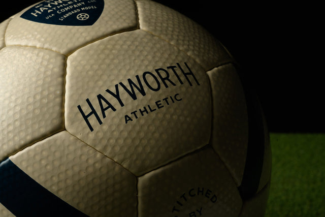 Hayworth Athletic standard model soccer ball with textured surface on grass background