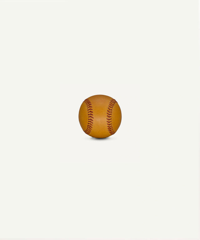 Horween leather baseball by Leather Head Sports with rich tan leather and red stitching