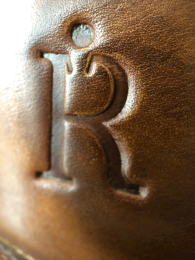 Close up of The Rafter Club logo embossed on brown leather Italian made mens dress shoe