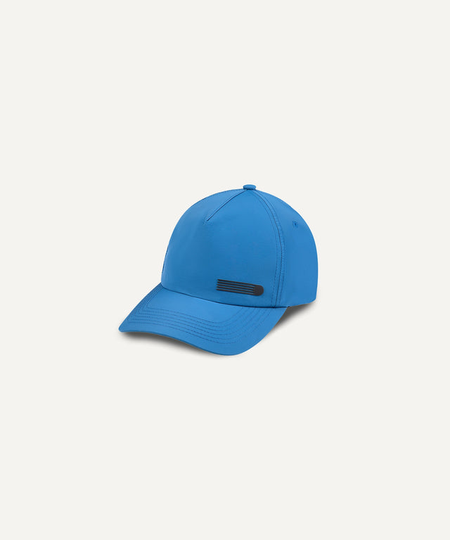 Kadet blue nylon baseball cap with curved brim and black logo detail