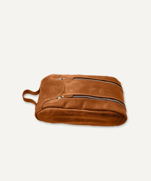 Pikore brown leather golf shoe bag with dual zipper compartments and a carrying handle