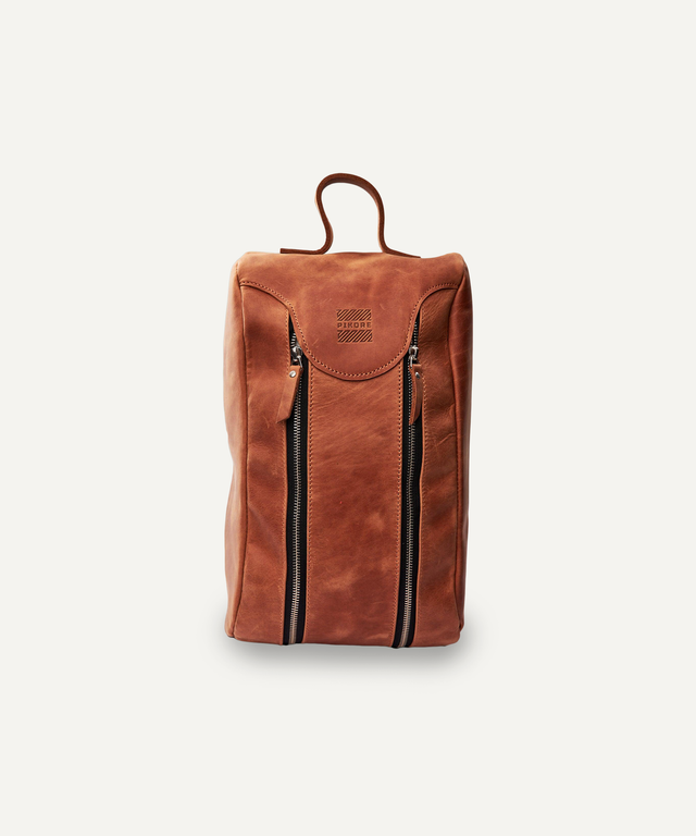 Pikore leather golf shoe bag in brown with dual vertical zippers and top handle for easy carrying