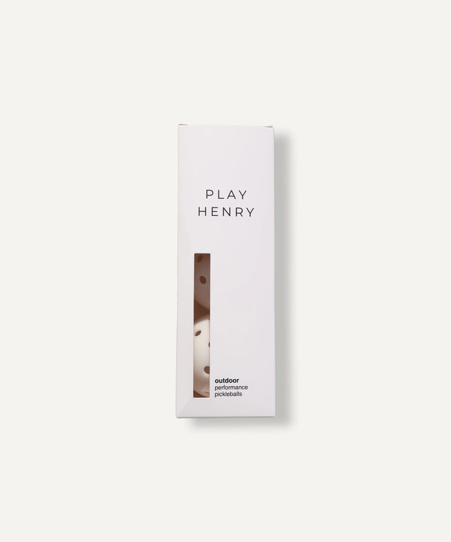 Play Henry white outdoor pickleball balls in slim white packaging with clear window display