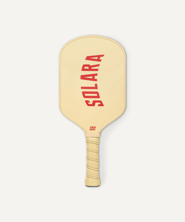 Solara 94 premium pickleball paddle in beige with red logo and wrapped grip handle