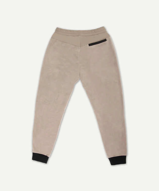 Solstice Athletics beige jogger pants with black cuffs and back pocket, premium workout clothing