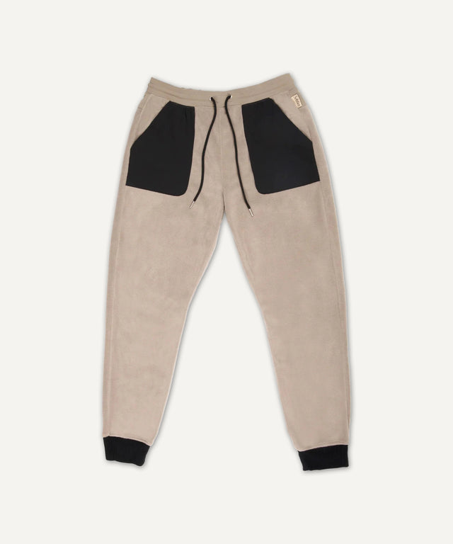 Solstice Athletics beige jogger pants with black pockets and cuffs in premium workout clothing
