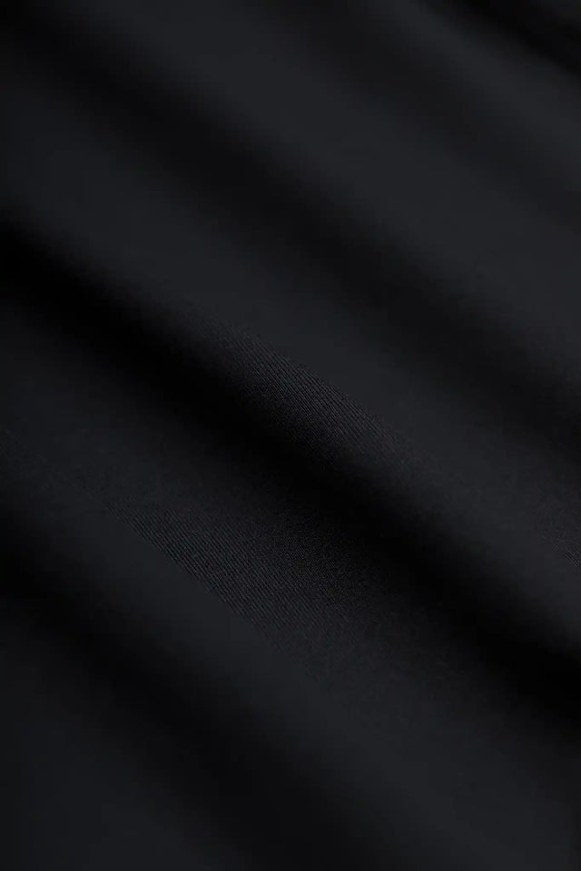 Close up of black fabric texture from Solstice Athletics premium workout clothing