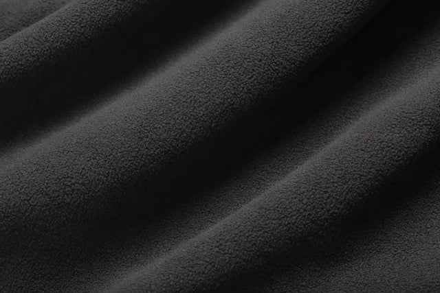 Close-up of soft black fabric texture from Solstice Athletics premium workout clothing