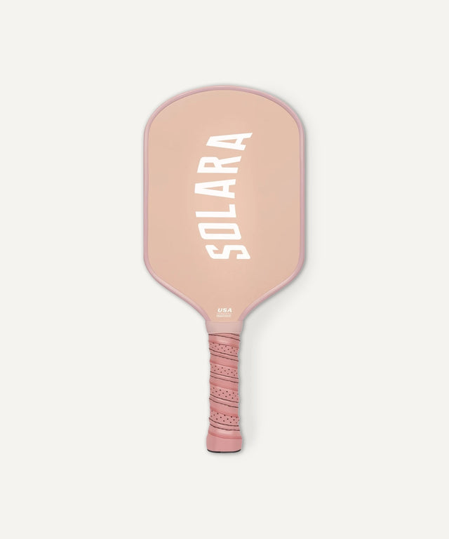 Solara 94 pink pickleball paddle with textured grip and bold white logo