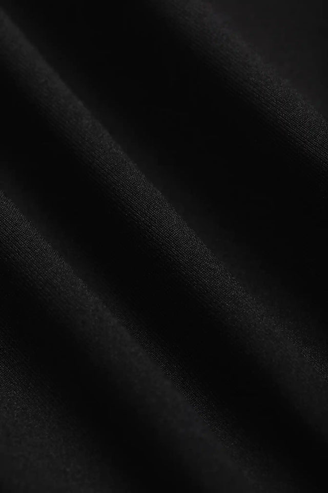 Close-up of soft black fabric texture by Solstice Athletics in premium workout clothing