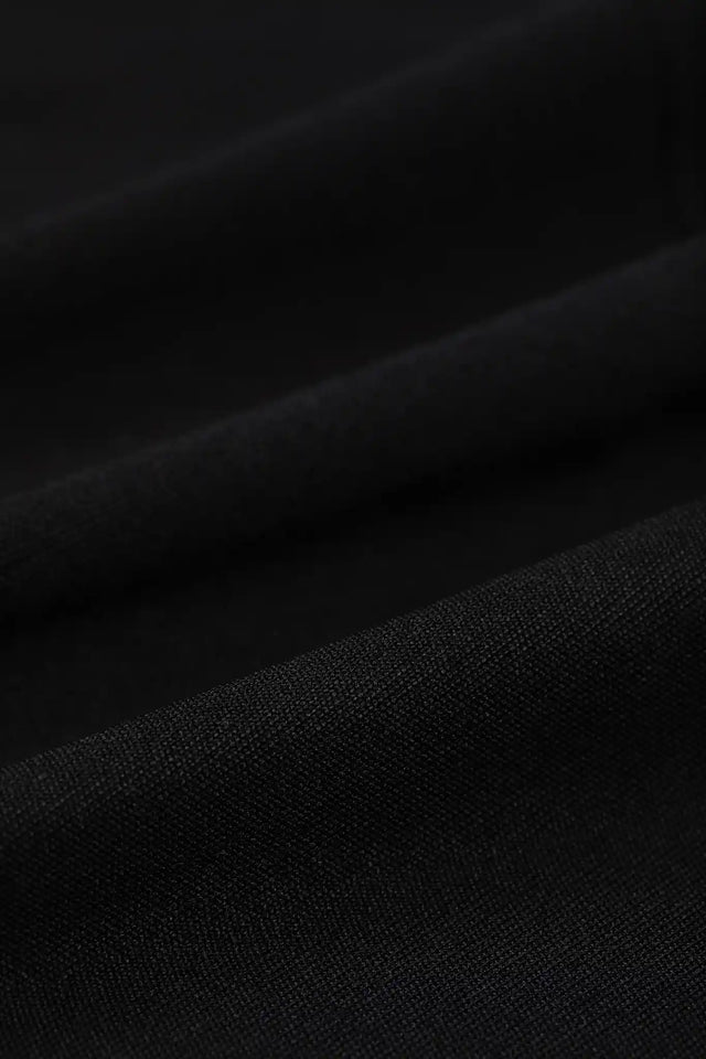 Close-up of black fabric texture from Solstice Athletics premium workout clothing