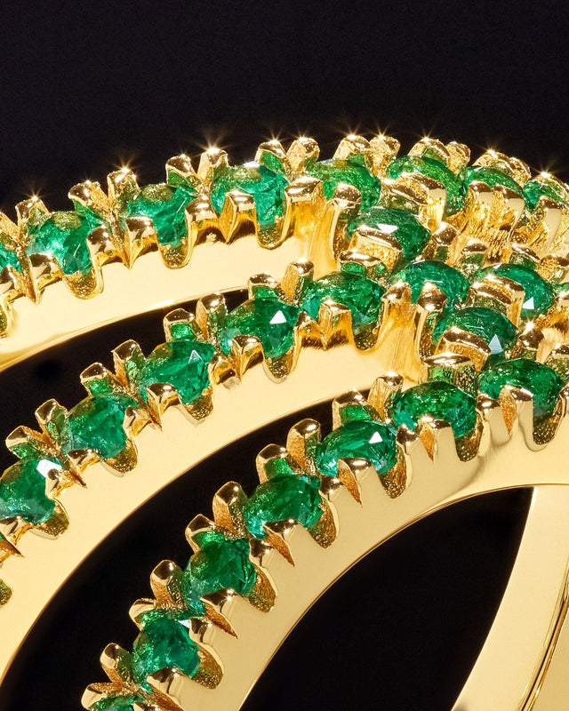 Victor Solomon basketball jewelry featuring gold rings with green stones perfect gifts for basketball fans