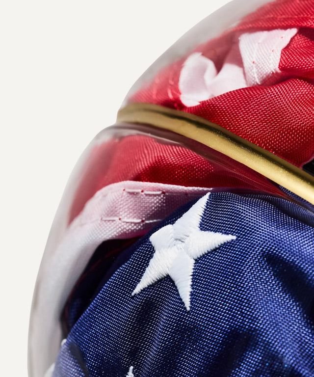 Victor Solomon basketball art featuring a close-up of a folded American flag in glass display, perfect gifts for basketball fans