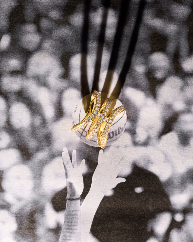 Victor Solomon basketball jewelry featuring a gold and diamond pendant on black cords, perfect gifts for basketball fans