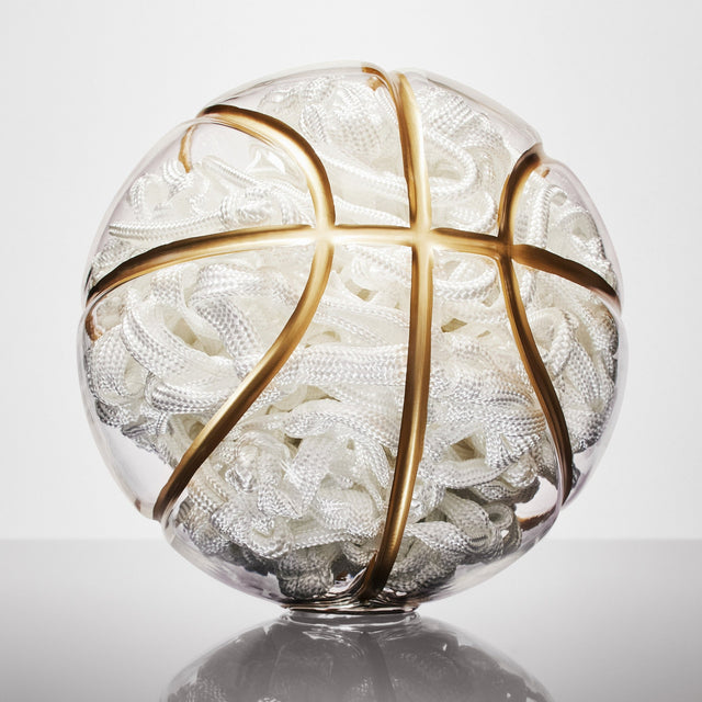 Basketball-shaped art sculpture by Victor Solomon with gold lines and intricate white interior, NBA collectibles gift