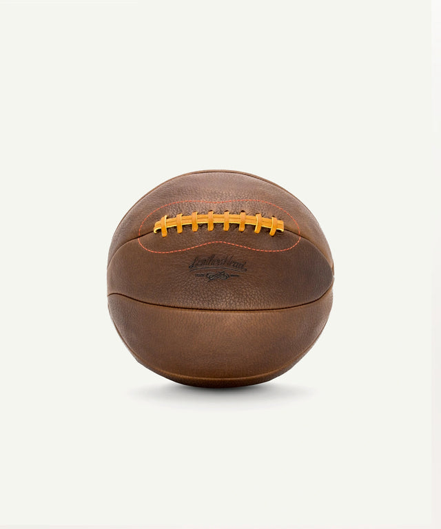 Leather Head Sports vintage leather medicine ball with stitched laces and classic brown design