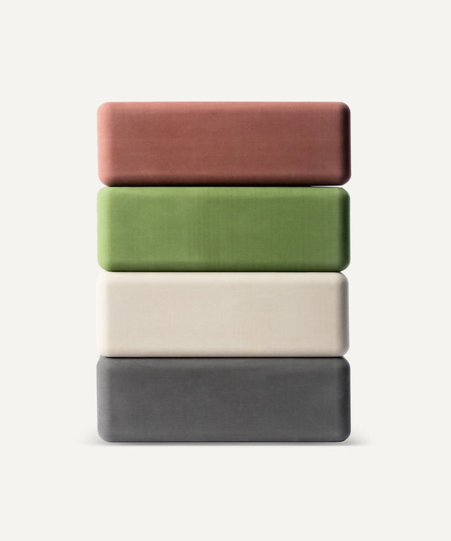 WeGym foam exercise block set in four colors stacked vertically for yoga and fitness support